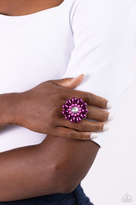 Featuring a glassy white gem center, bubbly oversized plum pearl petals fan out from dainty orchid pearl settings atop the finger on airy silver bands for a sophisticated floral fashion. Features a stretchy band for a flexible fit.  Sold as one individual ring.