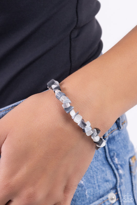 An earthy collection of gray and white chiseled pebbles are threaded along a stretchy band around the wrist in a free-spirited pattern.   Featured inside The Preview at Made for More! Sold as one individual bracelet.   New Kit