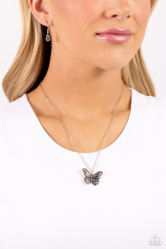 Filled with filigree, studded details, and dainty hematite accents, a rustic silver butterfly flutters from the bottom of a dainty silver chain for a whimsical fashion. Features an adjustable clasp closure.  Sold as one individual necklace. Includes one pair of matching earrings.