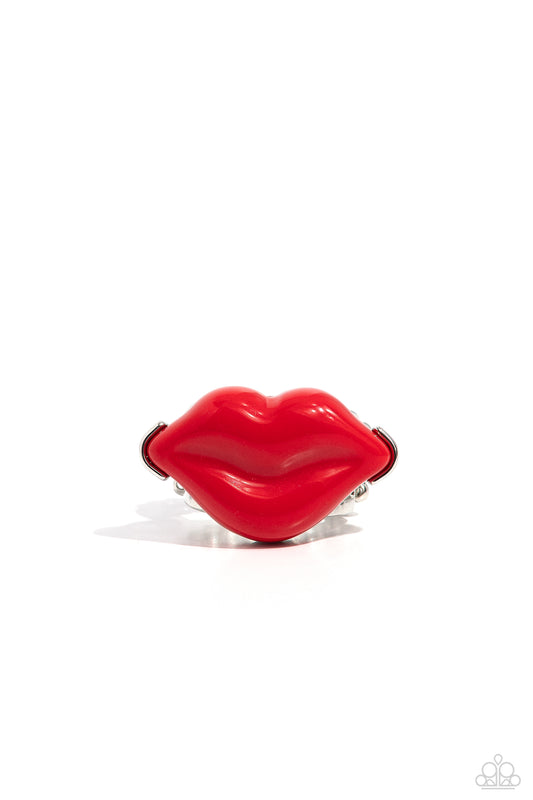Featured atop airy silver bands, a pair of red acrylic lips stands out atop the finger for a vibrant, carefree finish. Features a stretchy band for a flexible fit.   Featured inside The Preview at Made for More! Sold as one individual ring.   