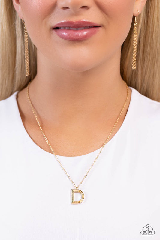 Etched in linear texture, a gold letter "D" hovers below the collar from a dainty gold chain, for a sentimentally simple design. Features an adjustable clasp closure.  Sold as one individual necklace. Includes one pair of matching earrings.