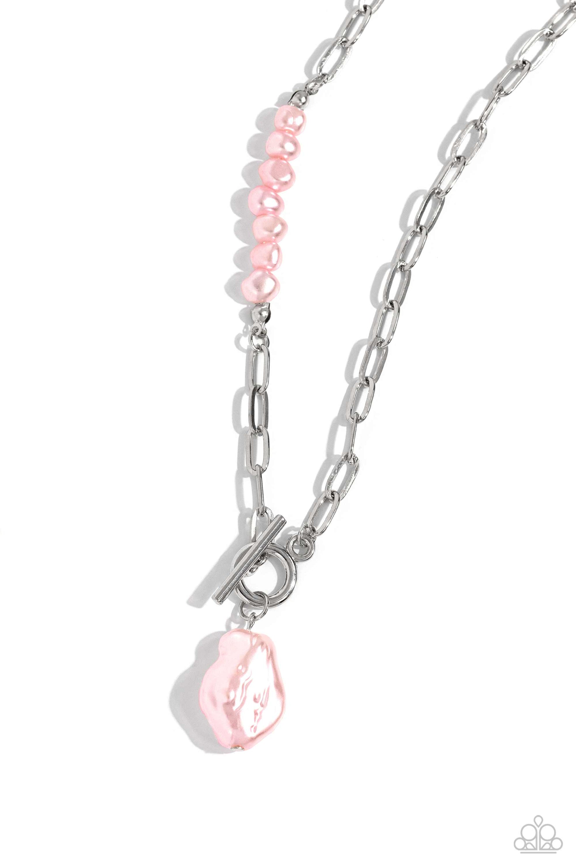 Featuring an elegant lariat closure, an oversized, baroque baby pink pearl cascades from the bottom of a silver paperclip chain for a refined fashion. Dainty, glossy baroque baby pink pearl beads are infused along one side of the silver chain for an additional touch of abstract sheen to the charming design.  Sold as one individual necklace. Includes one pair of matching earrings.