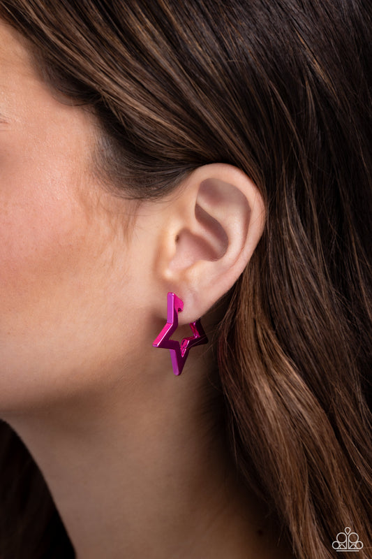 Dipped in an electric pink shade, a three-dimensional star-shaped hoop hinges around the ear resulting in a stellar statement. Earring attaches to a standard hinge closure fitting. Hoop measures approximately 1 1/4" in diameter.  Sold as one pair of hoop earrings.
