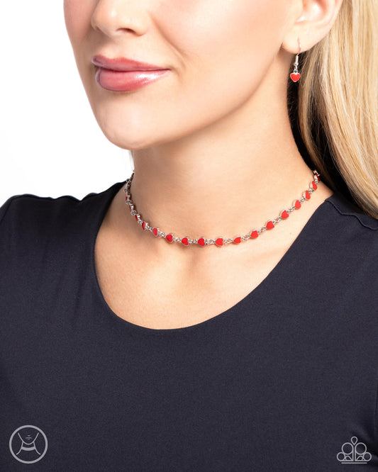 <p>Red-painted silver hearts interconnect around the collar for a simply sentimental look. Features an adjustable clasp closure.</p> <p><i>Sold as one individual choker necklace. Includes one pair of matching earrings. </i></p> &nbsp;<img src="https://d9b54x484lq62.cloudfront.net/paparazzi/shopping/images/517_chokericon_1.jpg" alt="Choker" align="middle" height="50" width="50">