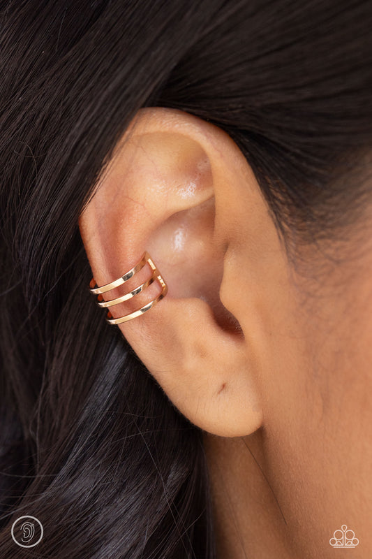 A trio of sleek gold bars arc around the ear in an airy, vertical pattern to create a trendy, adjustable, one-size-fits-all cuff.  Sold as one pair of cuff earrings.   Ear Cuff