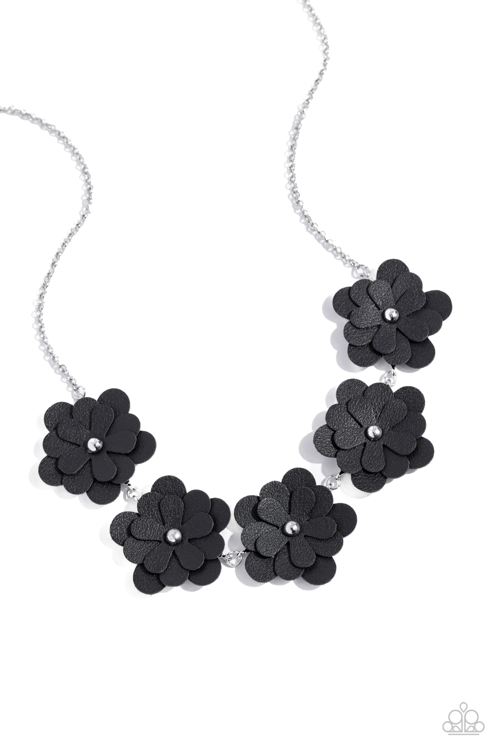 <p>Featuring silver stud centers, a collection of 3D black leather flowers connect to a classic silver chain for a ruggedly retro look. Features an adjustable clasp closure.</p> <p><i> Sold as one individual necklace. Includes one pair of matching earrings.</i></p>